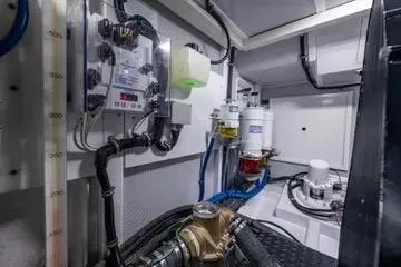 Slide: The Image of 2024 Northwest 55 engine room with advanced control systems and piping. - 100