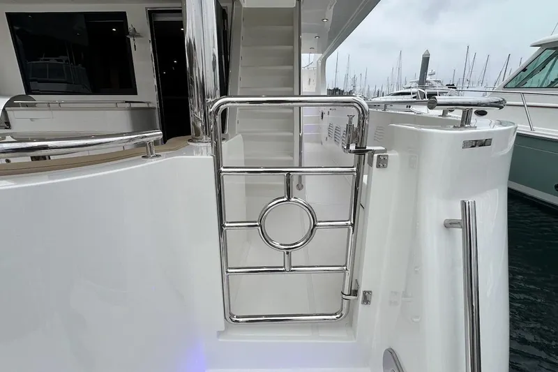 Slide: The Image of Stainless steel gate on 2024 Northwest 55 yacht, docked at marina. - 12