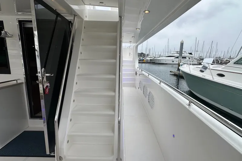 Slide: The Image of Luxurious Northwest 55 yacht interior with stairs, docked at marina, 2024 model. - 22