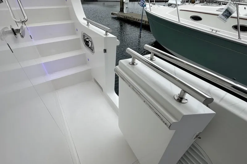 Slide: The Image of Modern Northwest 55 yacht deck with sleek design and stainless steel railings, 2024 model. - 24