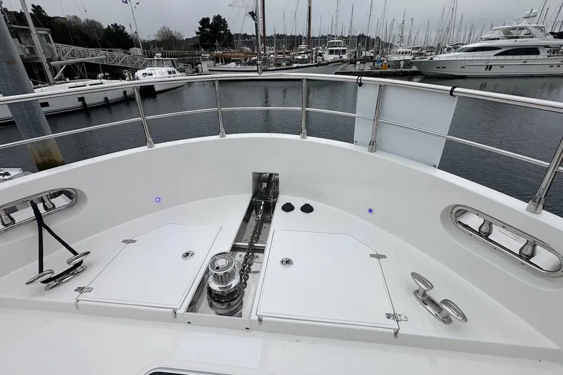 Slide: The Image of Bow of 2024 Northwest 55 yacht at marina, showcasing anchor system and sleek design. - 30