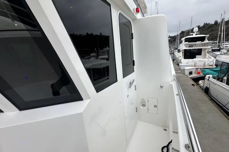 Slide: The Image of Sleek Northwest 55 yacht exterior, 2024 model, docked at marina with modern design. - 31