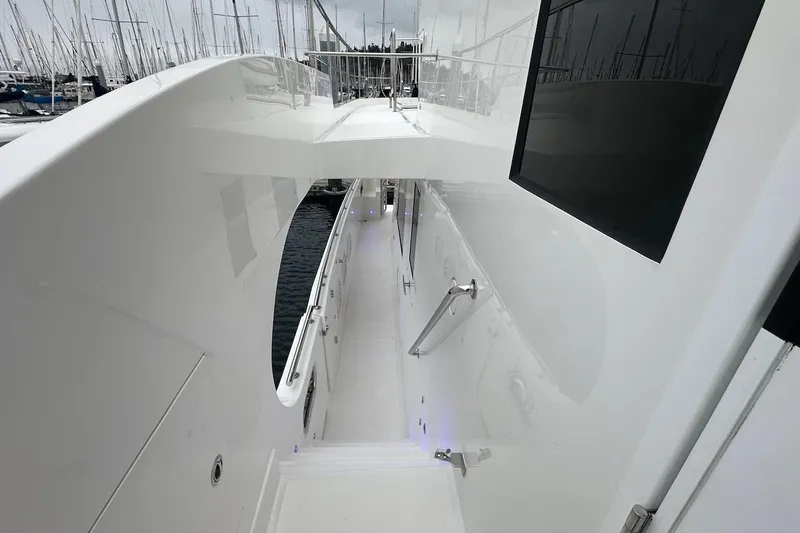 Slide: The Image of Sleek white deck of 2024 Northwest 55 yacht, featuring modern design and railing. - 32