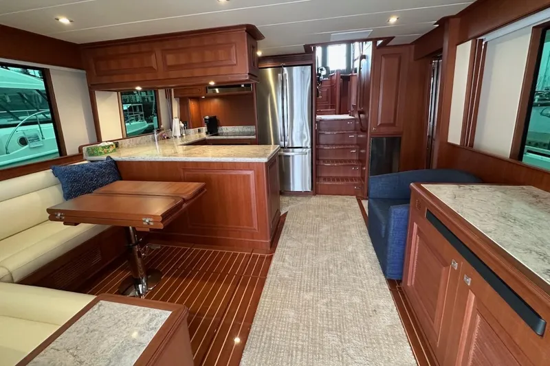 Slide: The Image of Luxurious interior of 2024 Northwest 55 yacht with modern kitchen and seating area. - 33