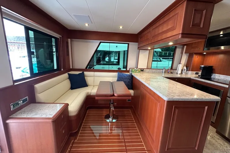 Slide: The Image of Luxurious 2024 Northwest 55 yacht interior with elegant wood finishes and modern kitchen. - 34