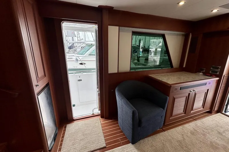 Slide: The Image of Luxurious interior of 2024 Northwest 55 yacht with elegant wood finishes and comfortable seating. - 37