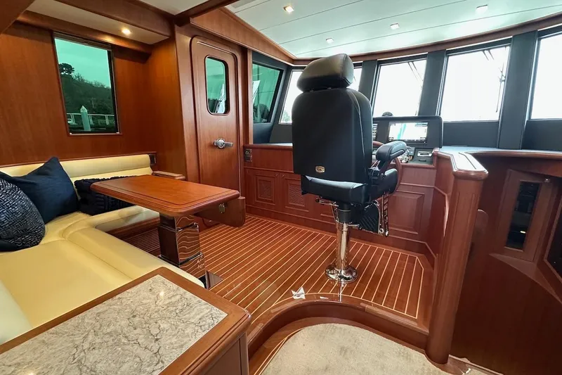 Slide: The Image of Luxurious interior of 2024 Northwest 55 yacht with plush seating and modern helm. - 43