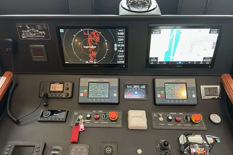 Slide: The Image of Control panel of a 2024 Northwest 55 yacht with advanced navigation displays. - 48