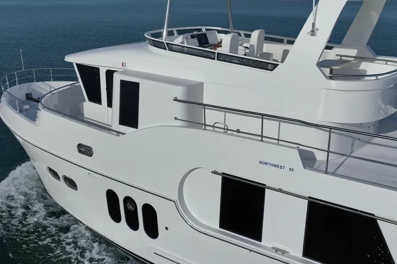 Slide: The Image of Luxurious 2024 Northwest 55 yacht cruising on calm blue waters. - 5