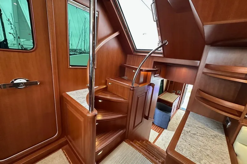 Slide: The Image of Luxurious interior of 2024 Northwest 55 yacht with wooden stairs and elegant design. - 50