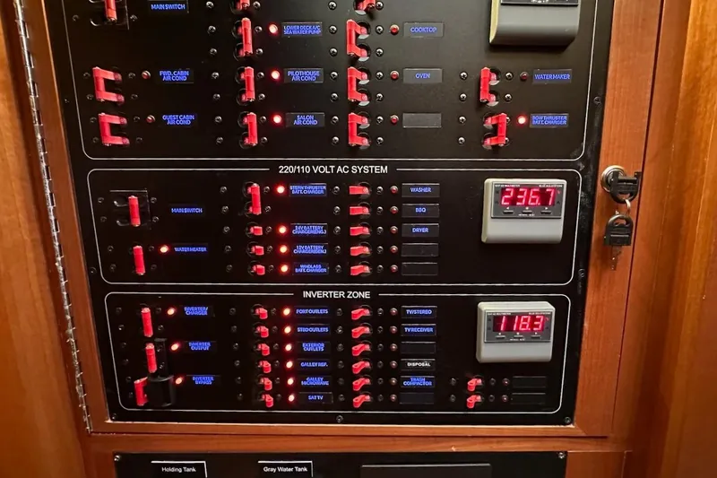 Slide: The Image of Electrical control panel with switches and voltage displays on a 2024 Northwest 55 model. - 52