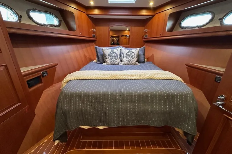 Slide: The Image of Luxurious cabin interior of 2024 Northwest 55 yacht with elegant wood finish. - 56