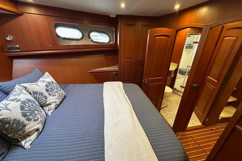 Slide: The Image of Luxurious cabin interior of 2024 Northwest 55 yacht with elegant wood finish. - 57