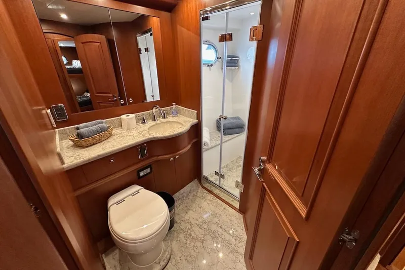 Slide: The Image of Luxurious 2024 Northwest 55 yacht bathroom with wood accents and modern amenities. - 61