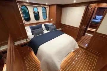 Slide: The Image of Luxurious cabin interior of 2024 Northwest 55 yacht with elegant wood finish. - 65