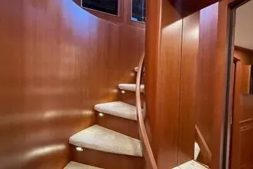 Slide: The Image of Elegant wooden spiral staircase in 2024 Northwest 55 yacht interior. - 74