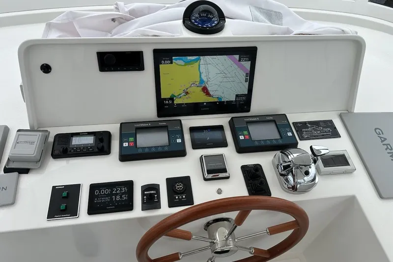 Slide: The Image of Boat control panel with navigation screens and instruments, Northwest 55, 2024 model. - 82