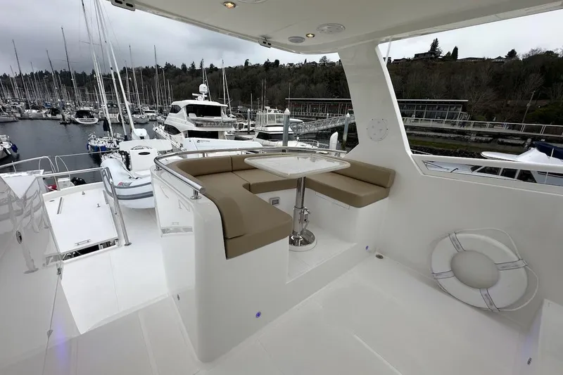 Slide: The Image of Luxurious Northwest 55 yacht interior with seating area, docked at marina, 2024 model. - 83