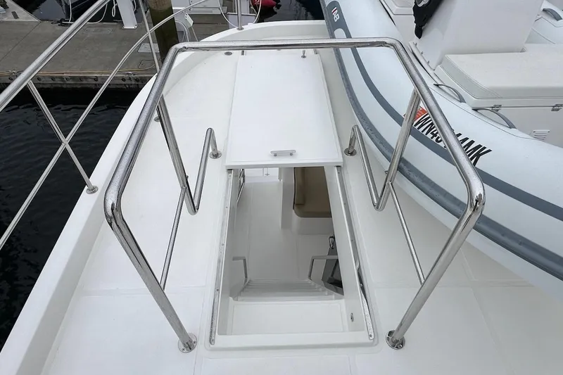 Slide: The Image of Stairway on 2024 Northwest 55 yacht deck, featuring stainless steel railings. - 90