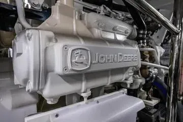 Slide: The Image of Close-up of a John Deere engine in a 2024 Northwest 55 model. - 94