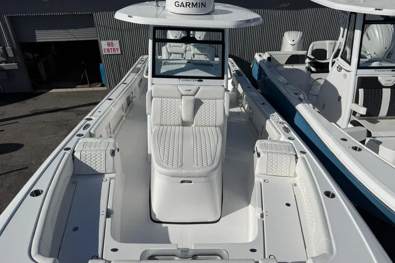 Slide: The Image of 2026 Tidewater 3100 Carolina Bay boat with sleek design and luxurious seating. - 9