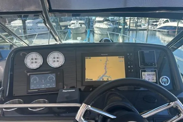 Slide: The Image of 2018 Formula 40 Performance Cruiser dashboard with navigation and control instruments at marina. - 13
