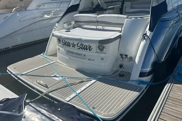 Slide: The Image of 2018 Formula 40 Performance Cruiser docked, featuring spacious deck and seating area. - 2