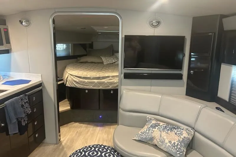 Slide: The Image of 2018 Formula 40 Performance Cruiser interior with bed, TV, and seating area. - 24