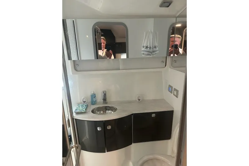 Slide: The Image of 2018 Formula 40 Performance Cruiser bathroom with modern sink and mirrored cabinet. - 28