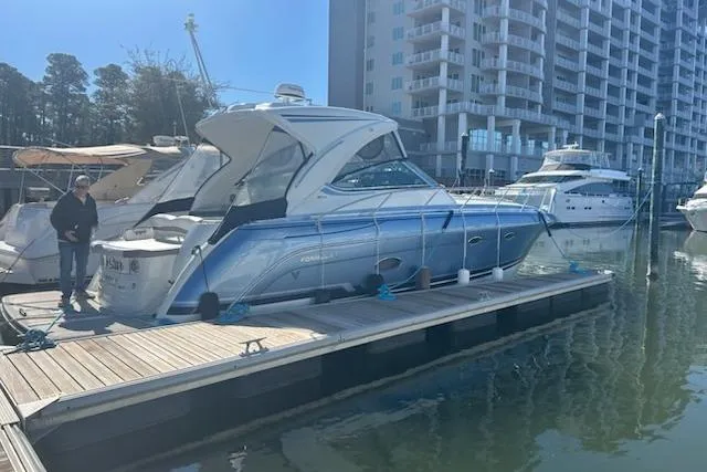 Slide: The Image of 2018 Formula 40 Performance Cruiser docked at marina with modern buildings in background. - 4