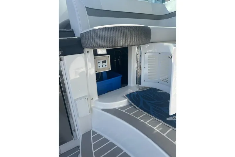 Slide: The Image of 2018 Formula 40 Performance Cruiser interior with open storage compartment and control panel. - 6