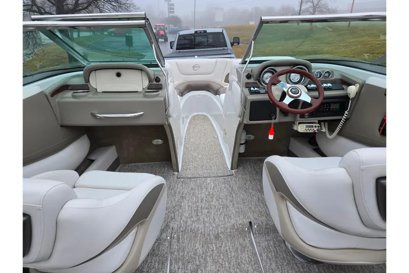 Slide: The Image of Interior view of 2012 Crownline 235 SS boat with modern dashboard and seating. - 12