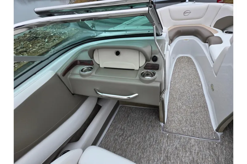 Slide: The Image of 2012 Crownline 235 SS boat interior with seating and cup holders. - 14