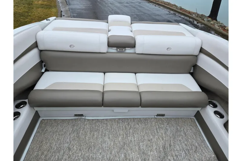 Slide: The Image of 2012 Crownline 235 SS boat interior with beige and white cushioned seating. - 24