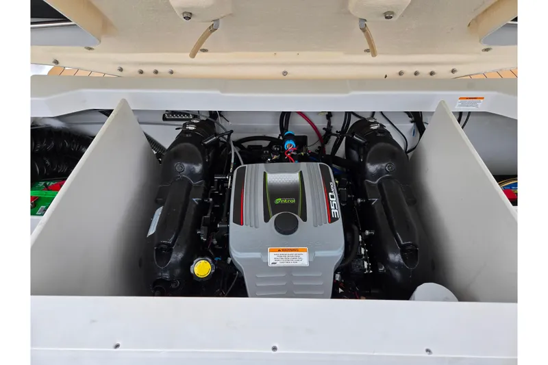 Slide: The Image of 2012 Crownline 235 SS engine compartment showcasing a powerful 350 MAG engine. - 26