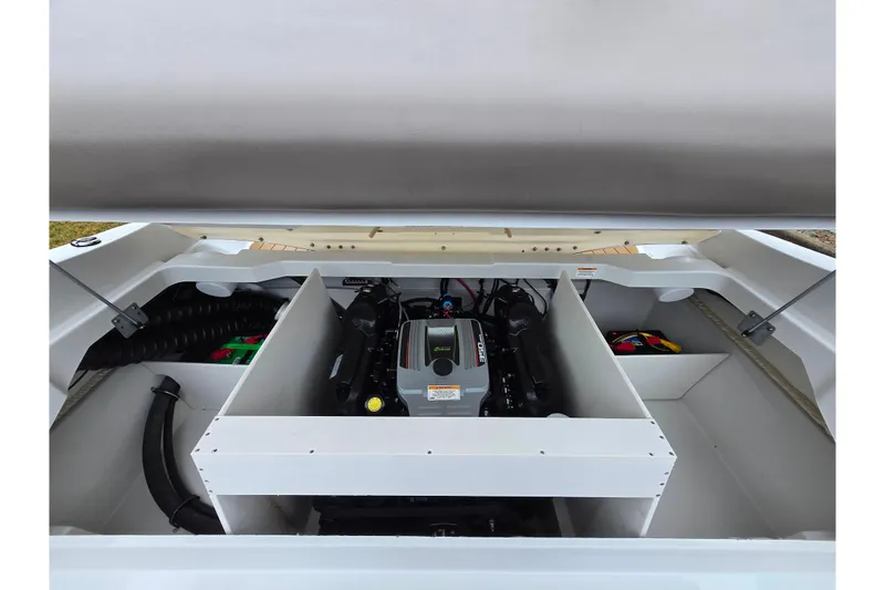 Slide: The Image of 2012 Crownline 235 SS boat engine compartment, showcasing a clean and organized layout. - 27