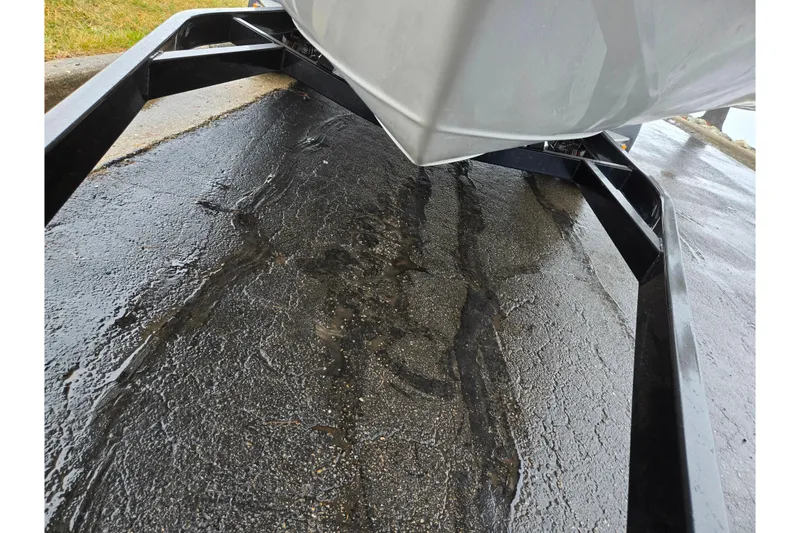 Slide: The Image of 2012 Crownline 235 SS boat on a trailer, close-up view of hull and frame. - 7