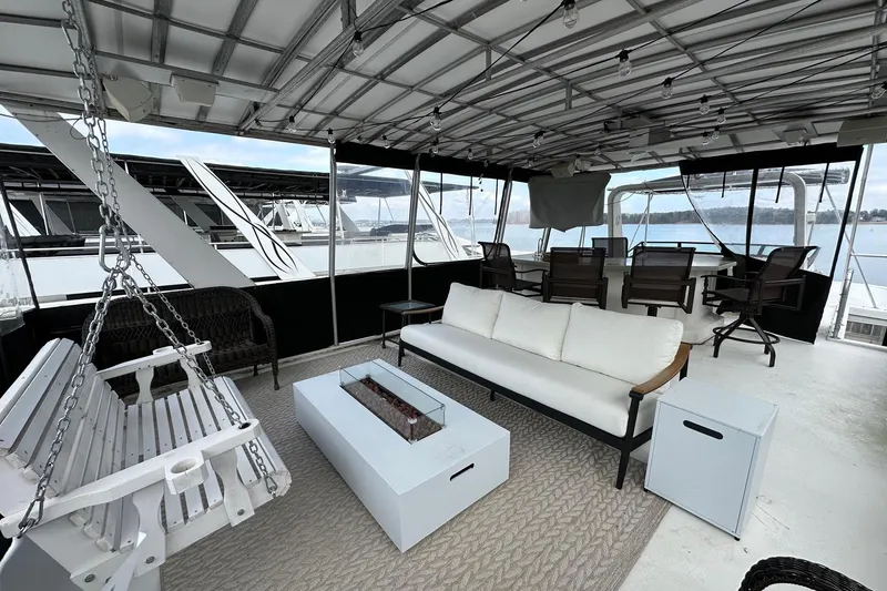 Slide: The Image of Luxurious 2005 Sumerset 16x68 houseboat with spacious outdoor seating and scenic water views. - 14