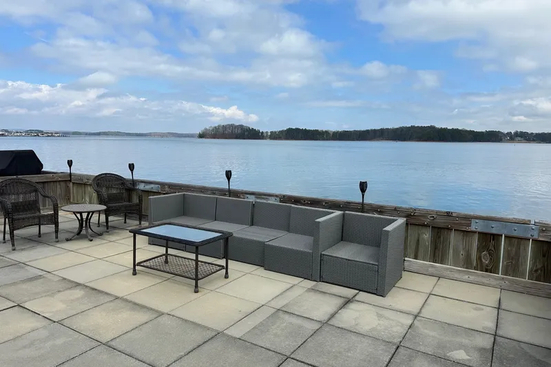 Slide: The Image of Rooftop patio on 2005 Sumerset 16x68 houseboat with lake view and outdoor seating. - 18