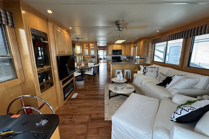 Slide: The Image of Luxurious 2005 Sumerset 16x68 houseboat interior with modern furnishings and spacious layout. - 2