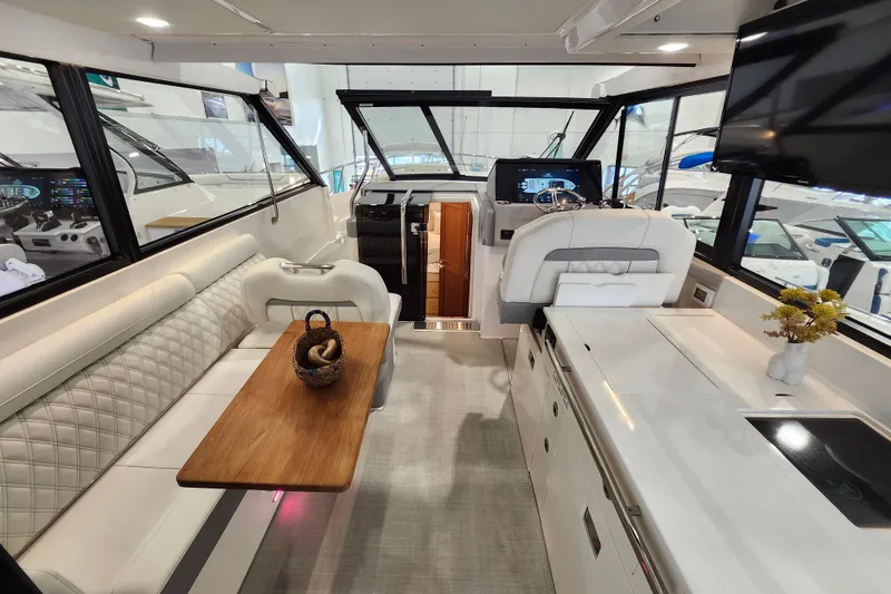 Slide: The Image of Luxurious interior of 2025 Regal 36 XO yacht with modern seating and sleek design. - 14