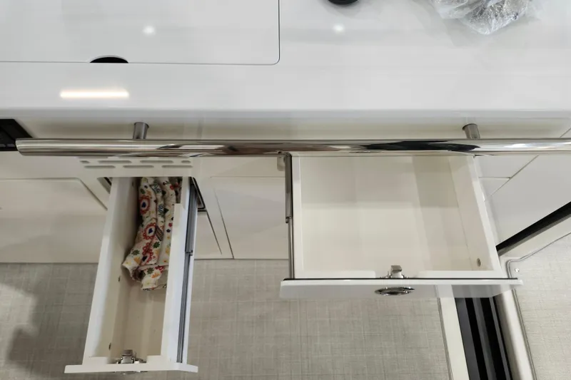 Slide: The Image of Open drawers in the 2025 Regal 36 XO yacht kitchen interior. - 23