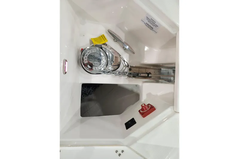 Slide: The Image of 2025 Regal 36 XO boat anchor compartment with winch and control panel. - 35
