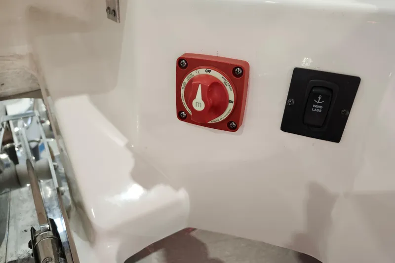 Slide: The Image of 2025 Regal 36 XO boat control panel with battery switch and windlass button. - 36