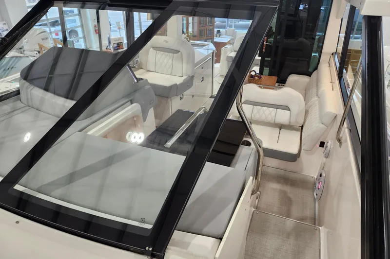 Slide: The Image of 2025 Regal 36 XO boat interior with luxurious seating and modern design. - 41