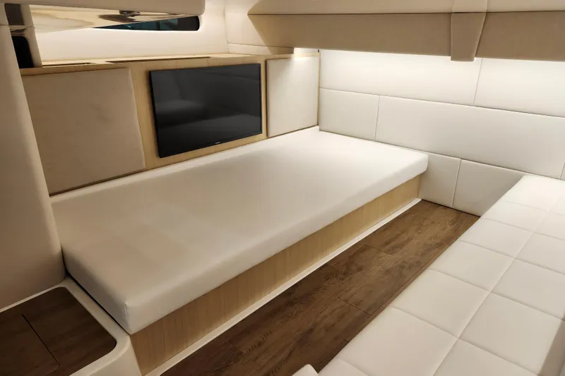 Slide: The Image of 2025 Regal 36 XO yacht interior with modern seating and wall-mounted TV. - 52