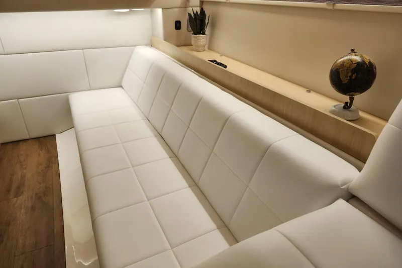 Slide: The Image of Luxurious interior of 2025 Regal 36 XO yacht with white seating and wooden accents. - 53