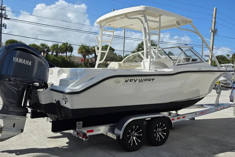The Image of 2020 Key West 239 DFS boat on trailer with Yamaha engine, parked outdoors. - 0