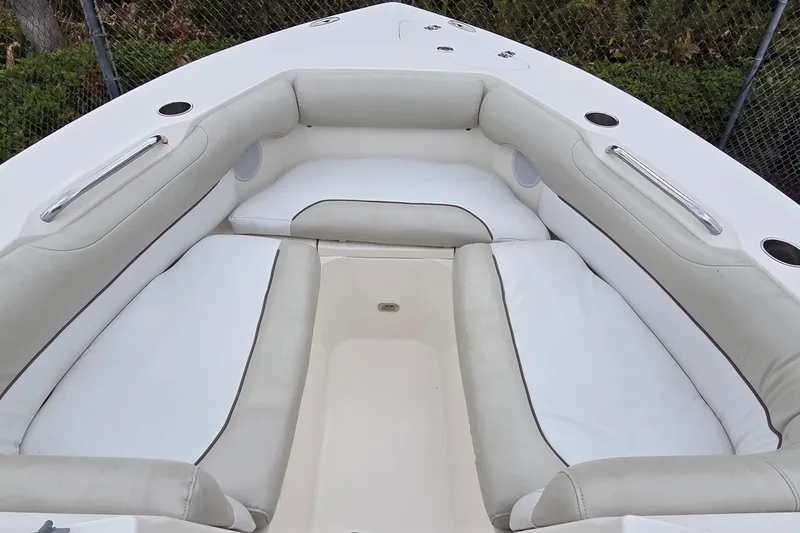 Slide: The Image of 2020 Key West 239 DFS boat interior with cushioned seating and cup holders. - 10