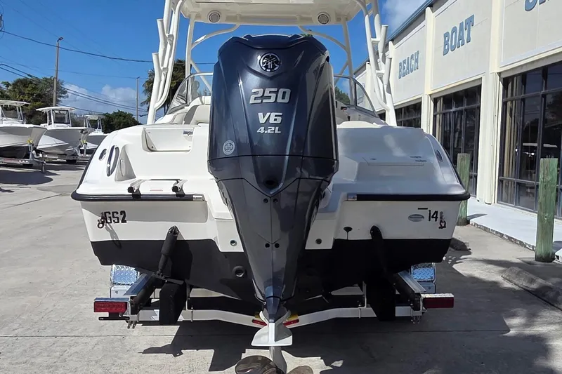 Slide: The Image of 2020 Key West 239 DFS boat with Yamaha 250 V6 engine at a marina. - 2